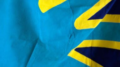 Tag der Gebärdensprachen. Die Flagge der Gehörlosen.