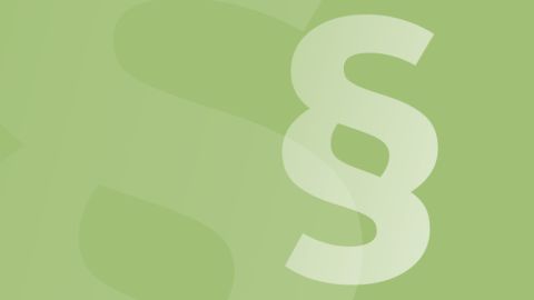 Paragraphensymbol vor grünem Hintergrund