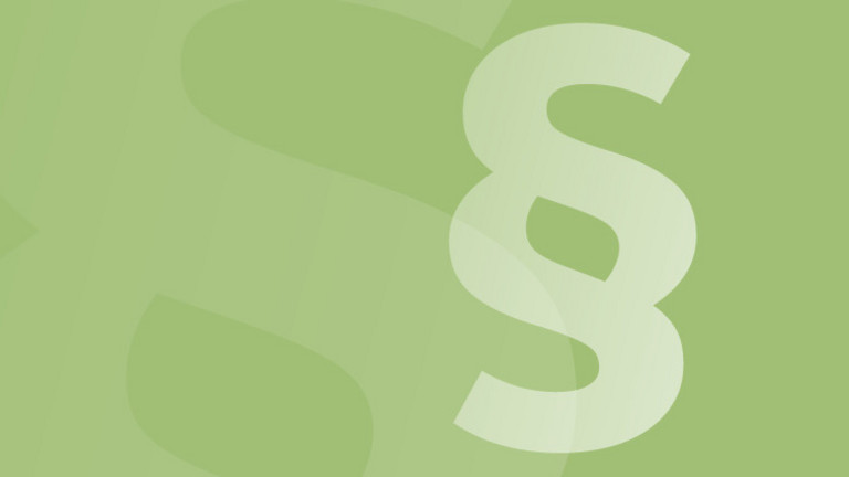 Paragraphensymbol vor grünem Hintergund